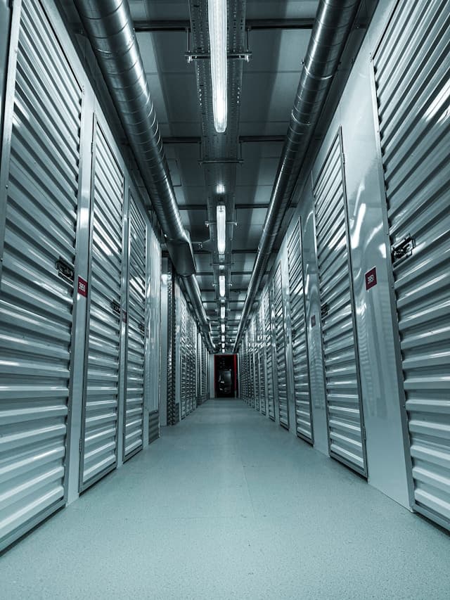 Self-storage facility corridor with orange unit doors